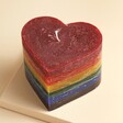The Recycled Candle Company Heart Rainbow Pride Candle against beige coloured background