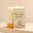 The Recycled Candle Company Ginger and Lime Octagon Candle on top of raised surface showing label
