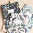 Rifle Paper Co. Set of 3 Peacock Notebooks on top of neutral coloured backdrop