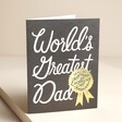 Rifle Paper Co. World's Greatest Dad Father's Day Card standing against beige backdrop