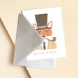 Rifle Paper Co. You're A Fox Valentine's Day Card with Silver Envelope Laying on Pink Surface