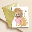 Rifle Paper Co. You're My Mane Squeeze Valentine's Day Card With Gold Envelope on Beige Surface