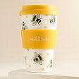 Sass & Belle Bee Travel Coffee Cup against beige coloured background