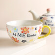 Sass & Belle Folk Floral Tea For One Teapot and Mug Set close up of mug with teapot in background against beige backdrop