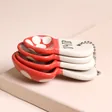 Sass & Belle Mushroom Measuring Spoons stacked on top of each other against neutral coloured backdrop