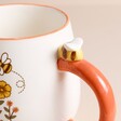 Close up of raised ceramic bee on Sass & Belle Retro Bee Happy Mug