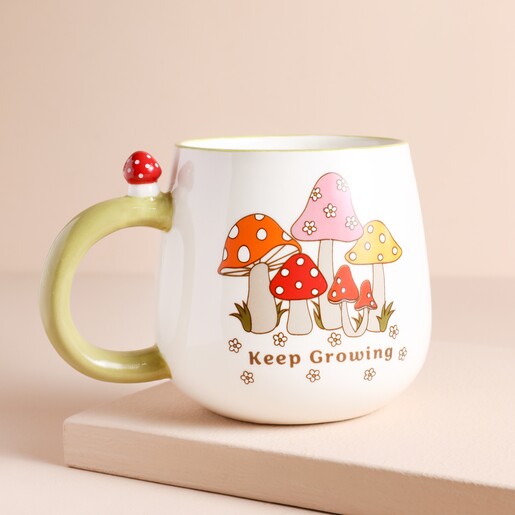 Sass & Belle Retro Keep Growing Mug Sass & Belle Retro Keep Growing Mug on top of raised surface with beige backdrop