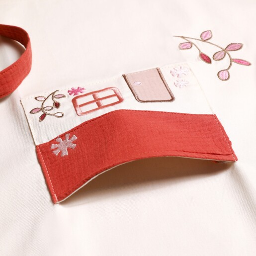 Close up of the pocket on Embroidered House Children's Apron