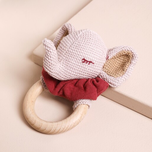 Rosalie Elephant Rattle on beige surface