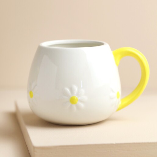 Ceramic Daisy Mug on Pink Surface