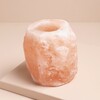 Himalayan Rock Salt Candle Holder against pink coloured background