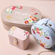 Personalised Embroidered Flowers Mini Round Velvet Jewellery Case with ring box and oval jewellery case against beige backdrop