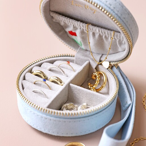 Personalised Embroidered Flowers Mini Round Velvet Jewellery Case open with jewellery inside against beige backdrop
