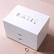 Personalised White Floral Jewellery Box with Drawers against neutral coloured backdrop with jewellery outside
