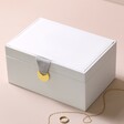 White Two Tier Jewellery Box closed against beige coloured backdrop