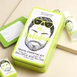 The Somerset Toiletry Co. Mr Holiday Travel Essentials Kit leaning against beige coloured backdrop