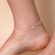 Dainty Flower Charm Anklet in Silver Close Up on Model