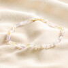 Pastel Semi-Precious Stone Beaded Anklet in Gold laid on top of neutral coloured fabric