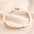 Freshwater Pearl Anklet in Gold on beige fabric
