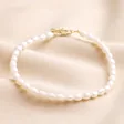 Freshwater Pearl Anklet in Gold on beige fabric