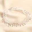 Vintage Effect Chain Anklet in Silver against beige coloured fabric