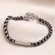 Men's Black Stainless Steel Box Chain Bracelet on top of beige coloured fabric