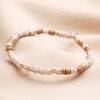 Brown and White Heishi Beaded Bracelet against neutral coloured material