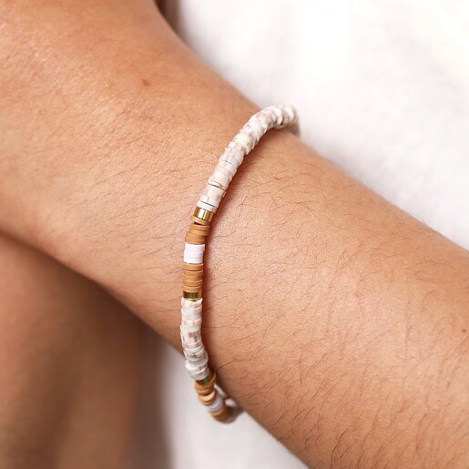 Model Wearing Brown and White Heishi Beaded Bracelet