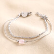Stainless Steel Pink Stone Double Layered Chain Bracelet on top of beige coloured fabricq