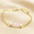 Rose Quartz Charm Chain Bracelet in Gold on Beige Fabric