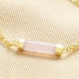 Close Up of Charm on Rose Quartz Charm Chain Bracelet in Gold