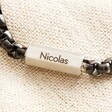 Close Up of Personalisation on the barrel charm reading the name Nicolas