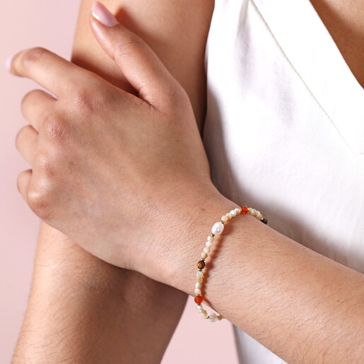 Natural Semi-Precious Stone and Pearl Beaded Bracelet on model with hand on arm