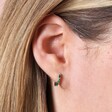 Green Baguette Crystal Huggie Hoop Earrings in Silver on Model