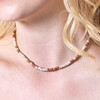 Close up of Brown and White Heishi Beaded Necklace on blonde haired model