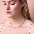 Model Wearing Double Chain and Star Charm Necklace in Gold