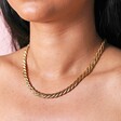 Close up of Gold Stainless Steel Chunky Triple Snake Chain Necklace on model