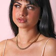 Gold Stainless Steel Chunky Triple Snake Chain Necklace on model against neutral background