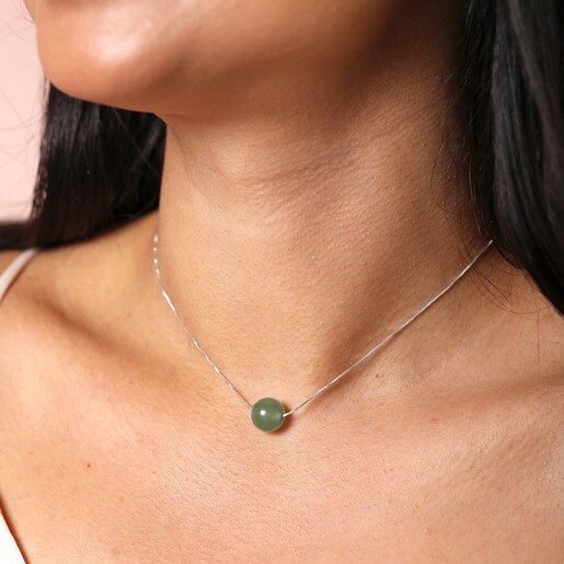 Close Up Necklace Worn Short on Model Close Up of Green Semi-Precious Stone Ball Pendant Necklace in Silver Worn Short on Model