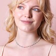 Stainless Steel Blue Crystal Chip Necklace on model against pink backdrop