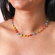 Close Up of Multicoloured Daisy Beaded Necklace in Gold on Model