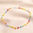 Multicoloured Daisy Beaded Necklace in Gold on Pink Fabric
