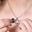 Model holding Personalised Photo Antiqued Crystal Star Oval Locket Necklace open showing photo