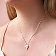 Close Up of Personalised Textured Double Heart Necklace in Silver on Model