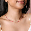 Red Stone Multicoloured Beaded Necklace on model smiling against neutral backdrop
