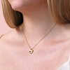 Close up of Gold Stainless Steel Crystal Antiqued Heart Pendant Necklace on model