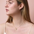 Gold Stainless Steel Crystal Antiqued Heart Pendant Necklace on model looking to side