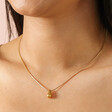 Close Up Model Shoot of Stainless Steel Teardrop Necklace in Gold