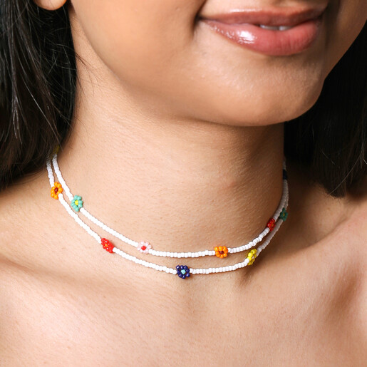 Layered Necklace on Model Close up of Colourful Daisy White Beaded Necklace on model worn as double layered necklace