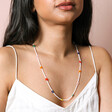 Colourful Daisy White Beaded Necklace full length on model against beige coloured backdrop